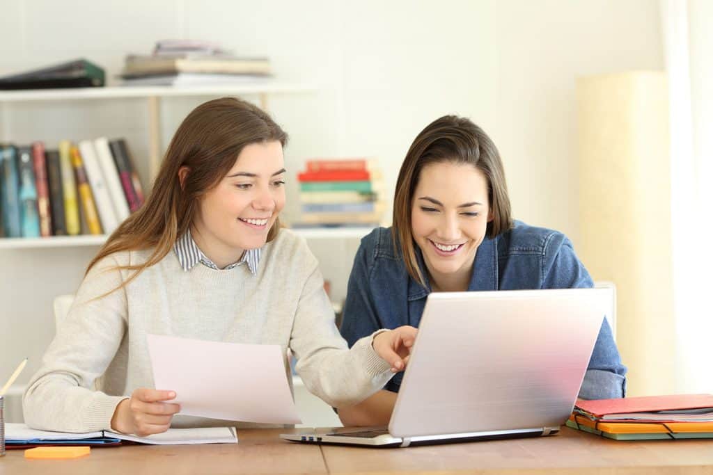 Two students researching college